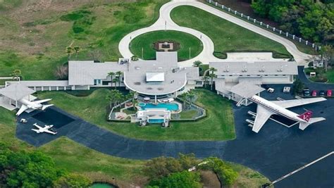 john travolta mansion with runway