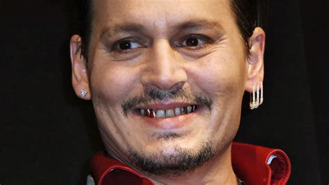 johnny depp chews front teeth