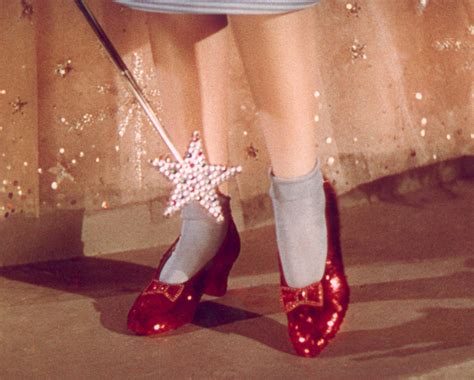 judy garland wearing ruby red slippers