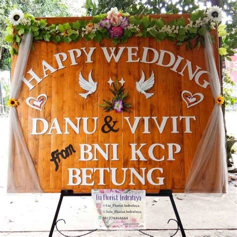 karangan bunga happy wedding dari DJPEN kemendag Hartini Florist