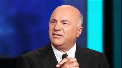 Kevin O'Leary in front of an FTX logo