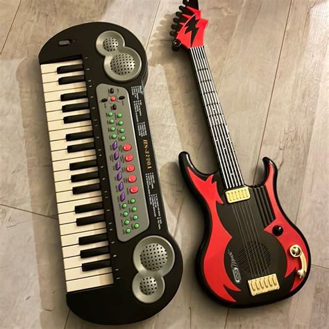 Guitar neck on old piano keys Stock Photo Colourbox