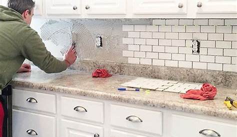 Installing my kitchen backsplash. It’s easier than what I expected. If
