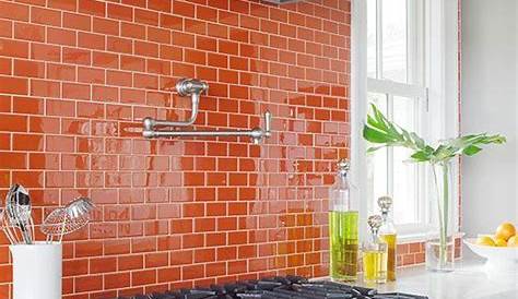 Beautiful use of orange tile as a counter top backsplash in the kitchen