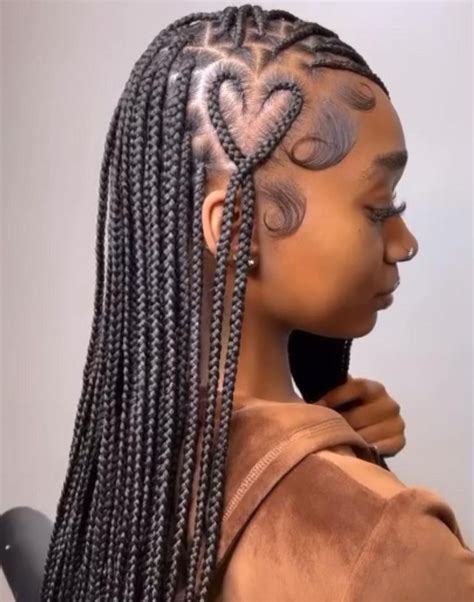 knotless box braids with a heart on the side