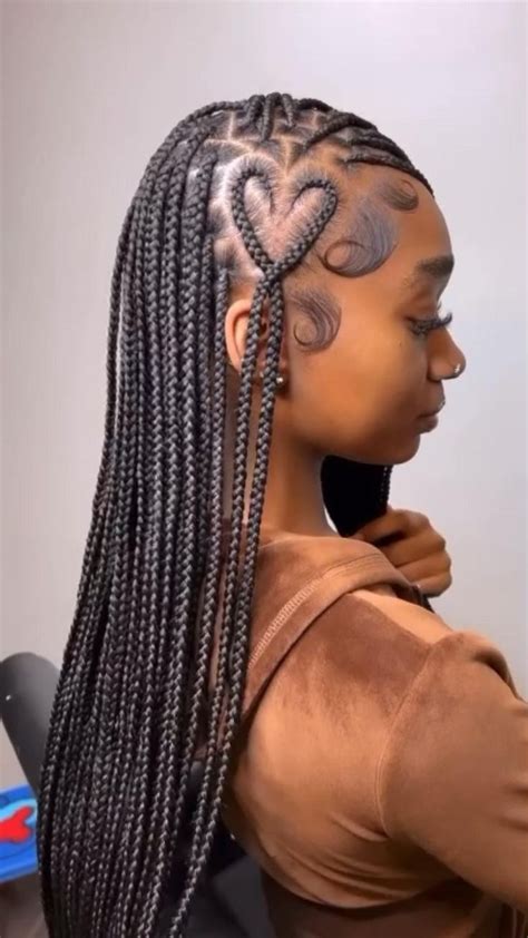 knotless box braids with a heart on the side