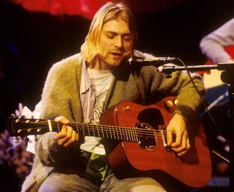 kurt cobain holding guitar
