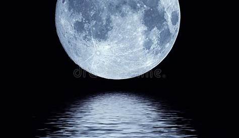 Full moon reflected in water Stock Photo - Alamy