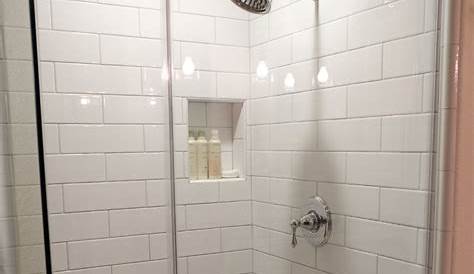 Large format tile and glass subway tile in this awesome shower Large
