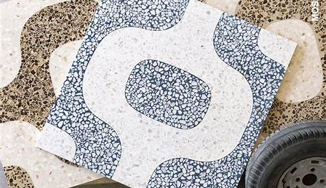 White terrazzo tiles with large green marble chips from