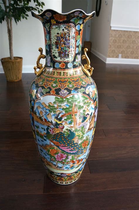 large oriental floor planter with coy on stand
