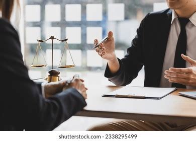 A lawyer explaining a will to a client