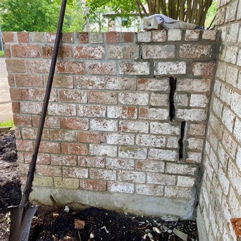 leaning brick wall repairs