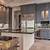light grey kitchen cabinets with dark wood floors