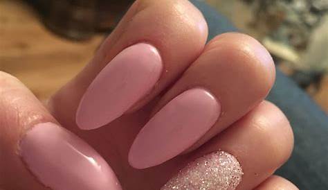 Almond shaped long nails with a very light pink color. Perfect