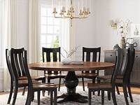 black chairs with light wood dining table, black lantern pendant over