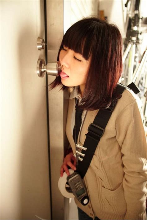 little asian girl with door handle