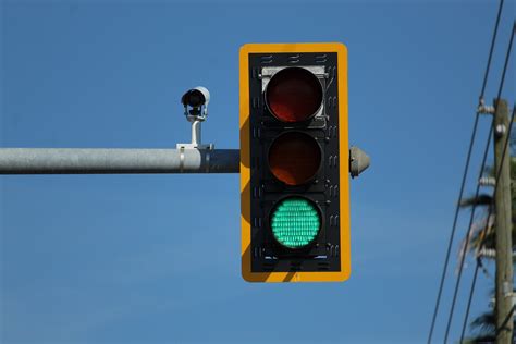 little black cameras on traffic lights