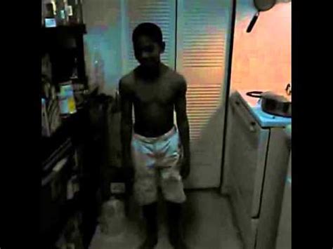 little black kid breaks glass door
