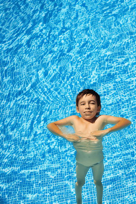 little boy loses swim trunks