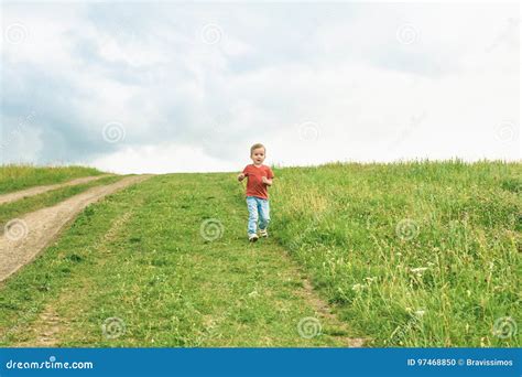 little boy running across a floor