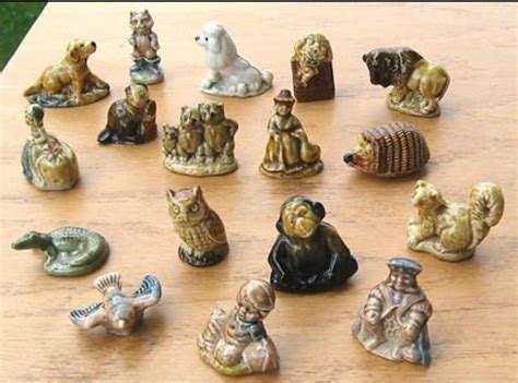 little ceramic statues inside tea boxes