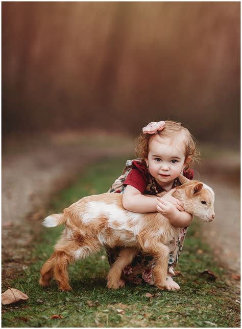 little goat and girl and the goat