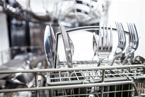loading utensils in dishwasher