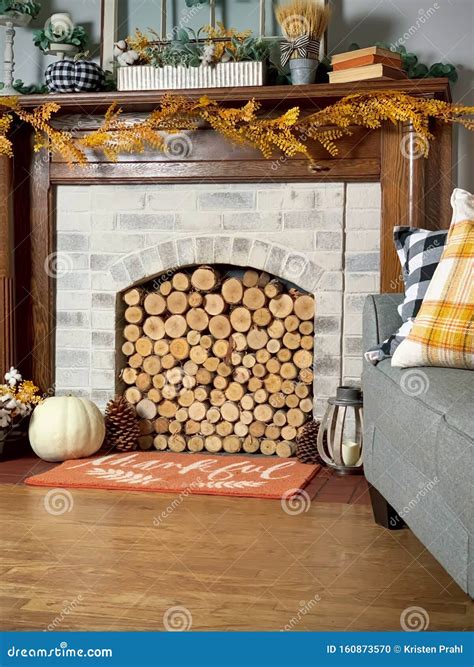 Logs Stacked In Fireplace