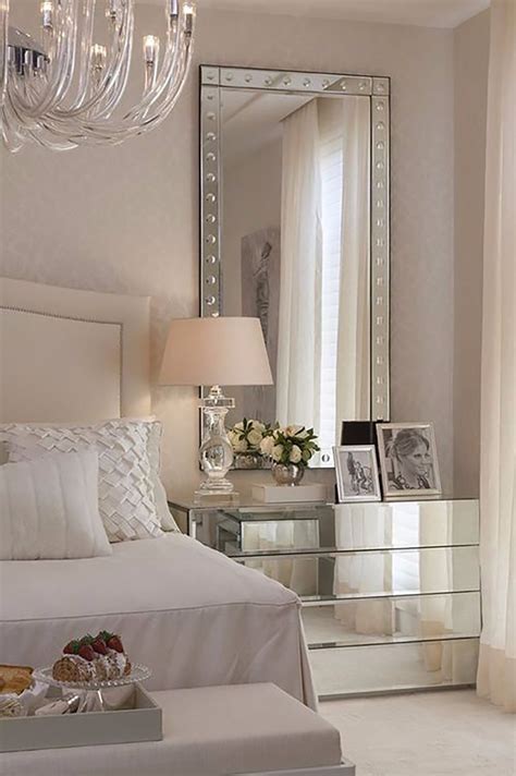 long mirror behind an end table in a bedroom