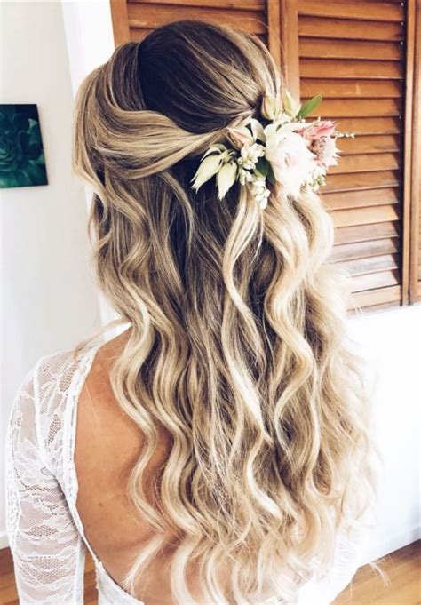 Half up half down bridal hairstyle. Loose beach waves that will hold