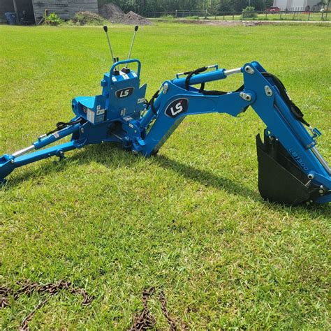 LS backhoe factory thumb