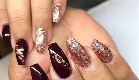 Luxe Appeal: Deep Burgundy Clothing With Champagne Nails For A Luxurious Feel