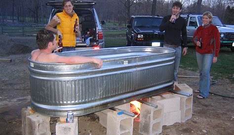 A 5-foot galvanized cattle trough connected to a heat lamp and a water