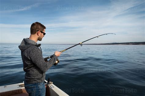 Man Fishing in the Ocean