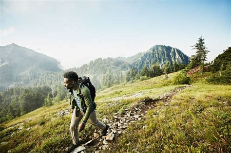 man hiking on a mountain trail