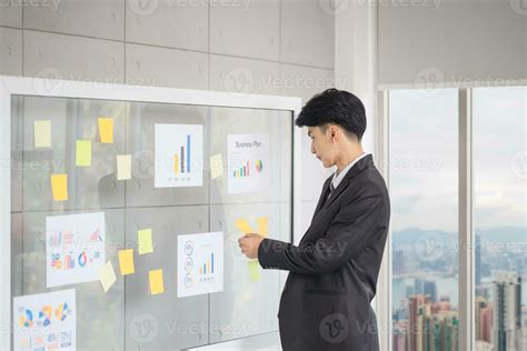 Man Writing Notes in a Notebook.