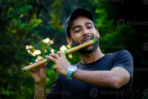 Man Playing A Flute
