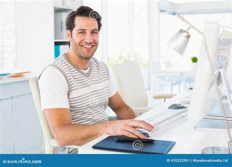 man smiling at computer