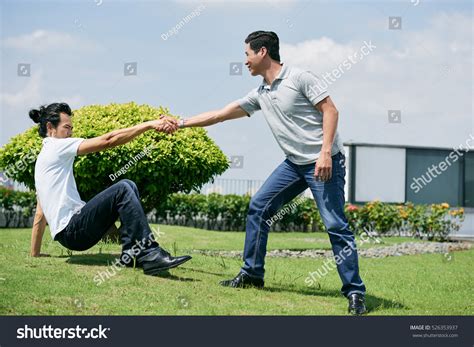 man standing after falling down