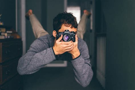 Man Taking Pictures With Camera