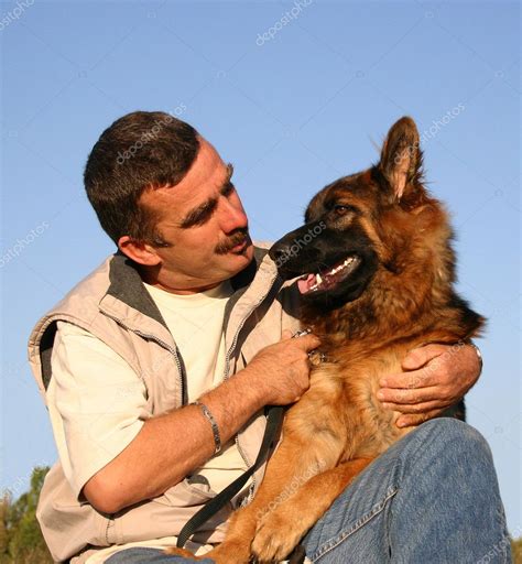 man with german shepherd