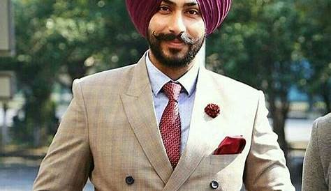 Which color turban matches with maroon blazer over sky
