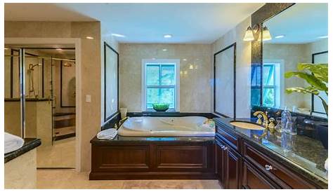 11-Luxurious master bath with jacuzzi tub, heated travertine floor and