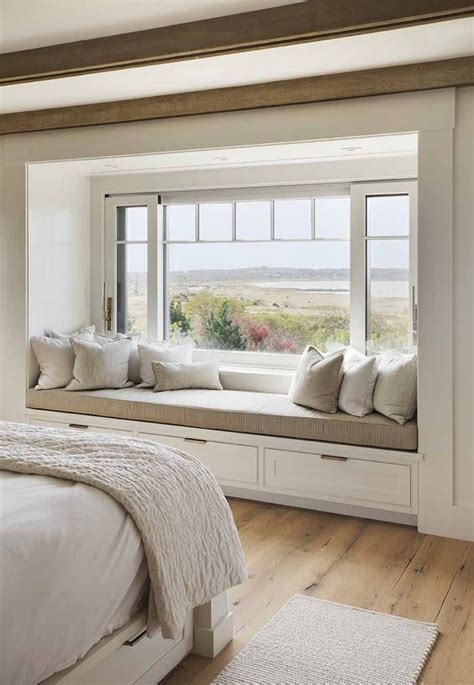 Custom master bedroom window seat with drawers and base