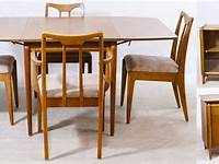 8 PIECE MCM DINING ROOM SET. TABLE , 6 CHAIRS, AND A TWO PIE
