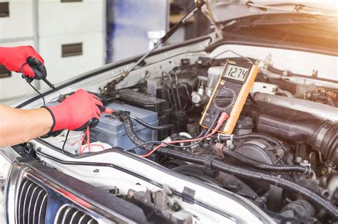 Mechanic checking car electrical system
