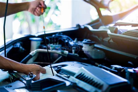 mechanic checking car engine