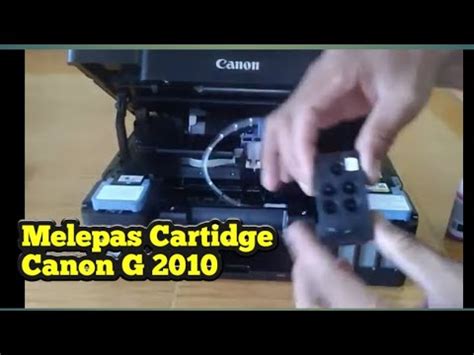 melepas cartridge canon g2010