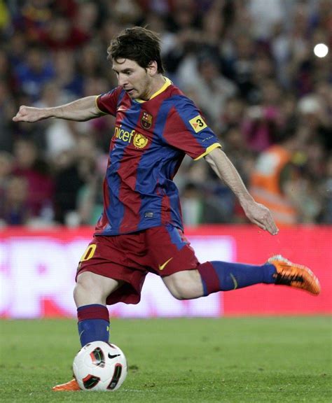 messi shooting a ball